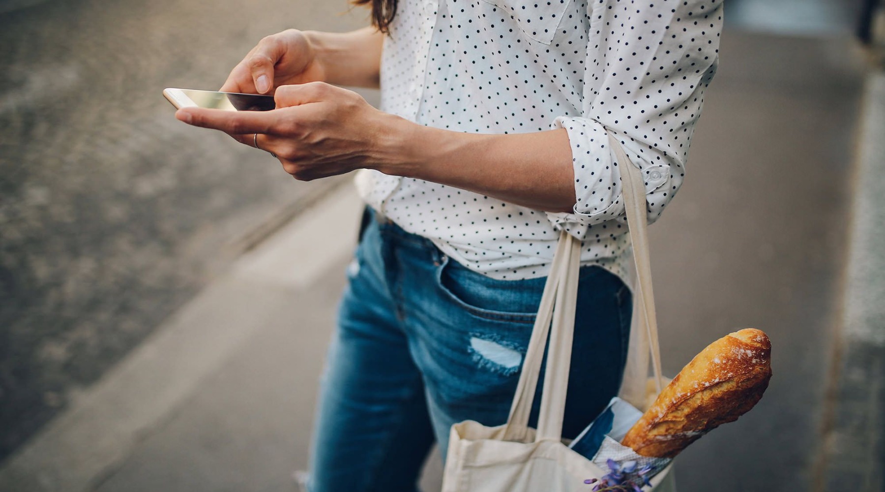 a woman with a bag of bread